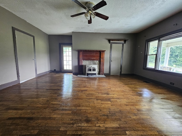 2783 No Pone Rd NW, Georgetown, TN 37336 - unfurnished living room featuring hardwood / wood-style floors, a textured ceiling, ceiling fan, and heating unit