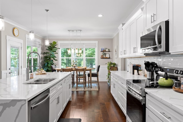 kitchen featuring white cabinetry, sink, a healthy amount of sunlight, and appliances with stainless steel finishes