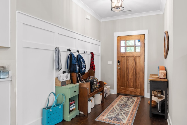 mudroom featuring crown molding and dark wood-type flooring