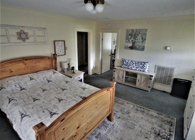 bedroom featuring dark carpet and a closet