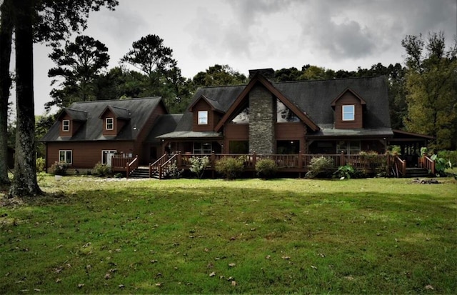 back of house with a lawn