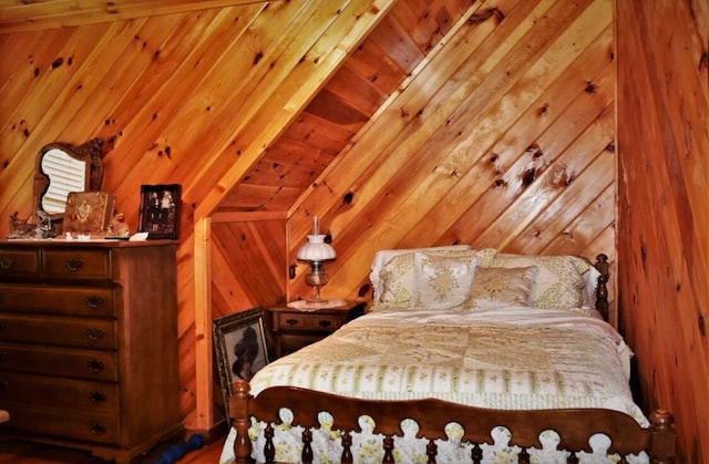 bedroom featuring vaulted ceiling with beams, wood walls, and wooden ceiling