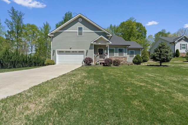 view of front of property with an attached garage, a front lawn, stone siding, and concrete driveway