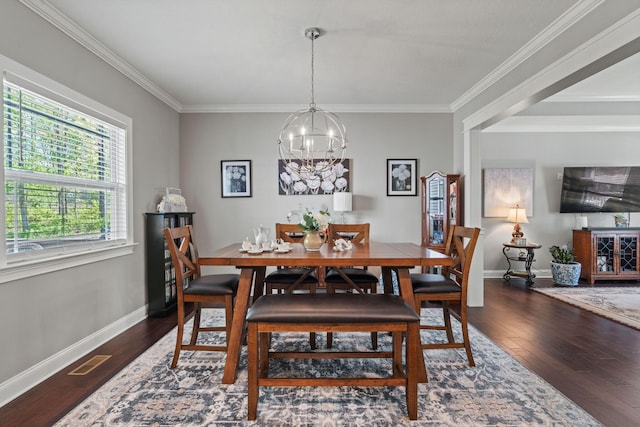 dining area with baseboards, a notable chandelier, wood finished floors, and visible vents