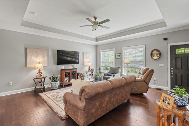 living room with a ceiling fan, baseboards, dark wood-style floors, and a raised ceiling