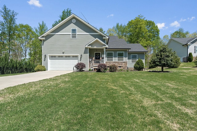view of front of home with a garage, driveway, and a front lawn