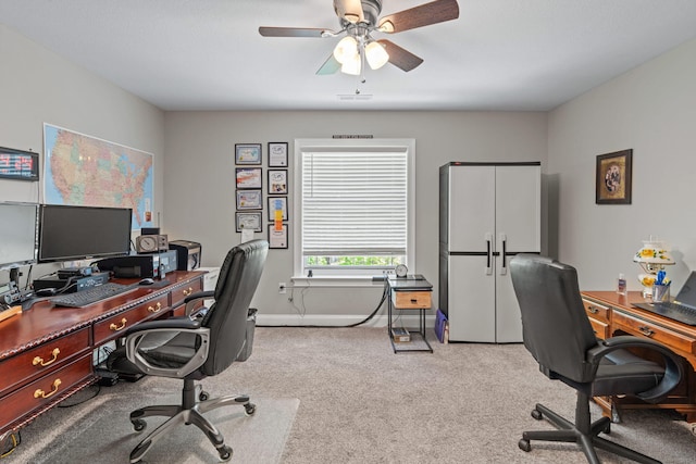 office featuring ceiling fan, baseboards, and carpet flooring