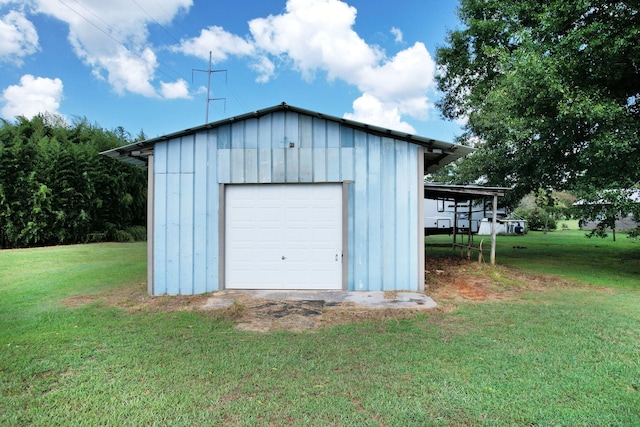 garage featuring a yard