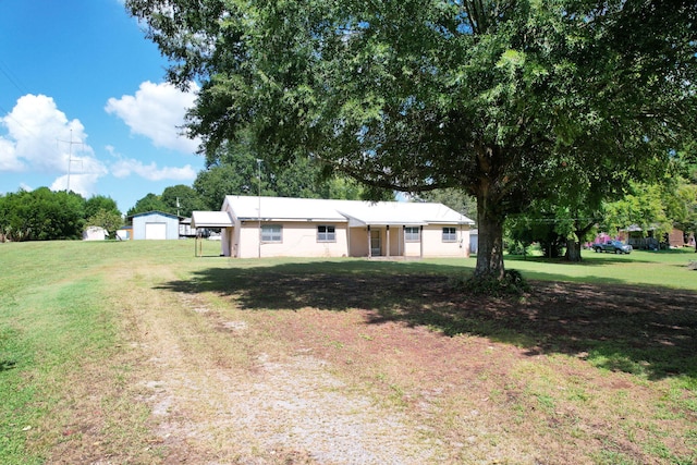 exterior space with an outbuilding and a garage