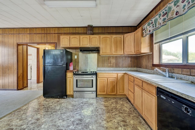 kitchen with sink, wooden walls, and black appliances