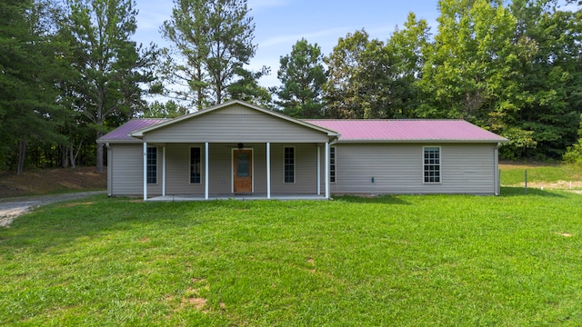 ranch-style house with a front lawn and covered porch