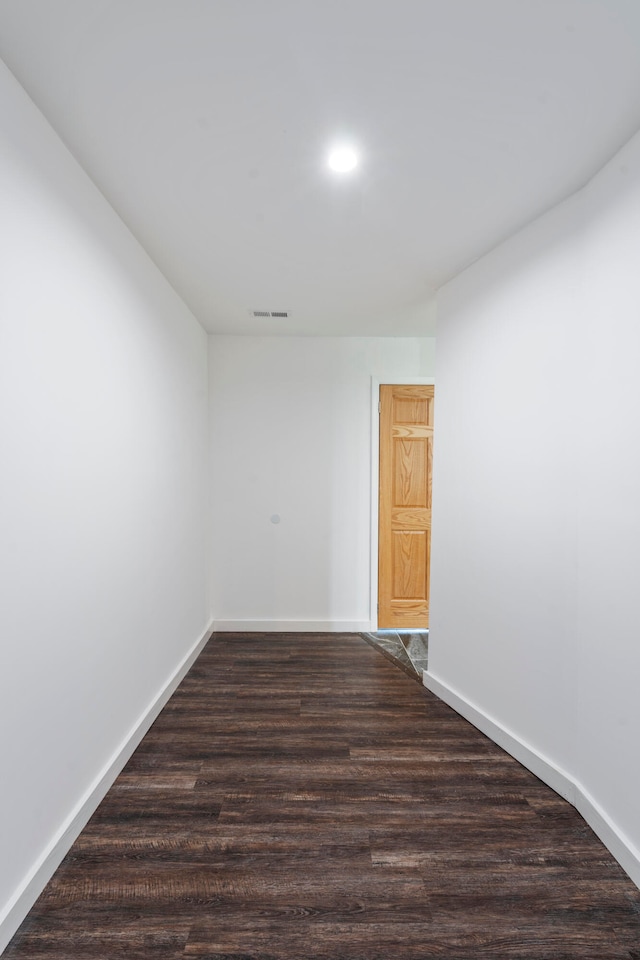 spare room featuring dark hardwood / wood-style floors