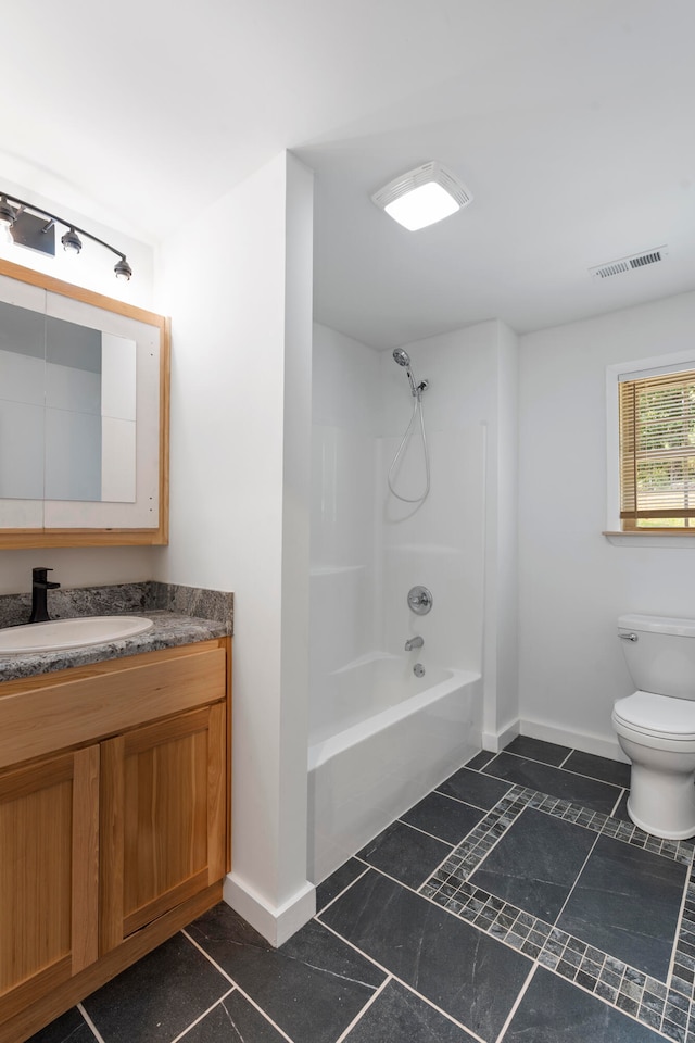 full bathroom with tile patterned flooring, vanity, toilet, and bathtub / shower combination