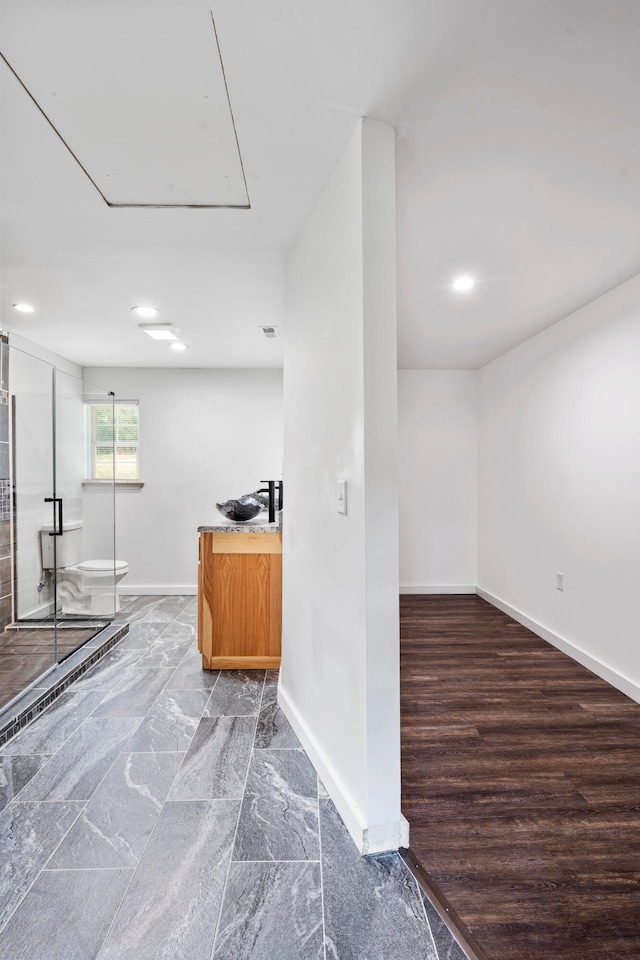 bar with hardwood / wood-style floors