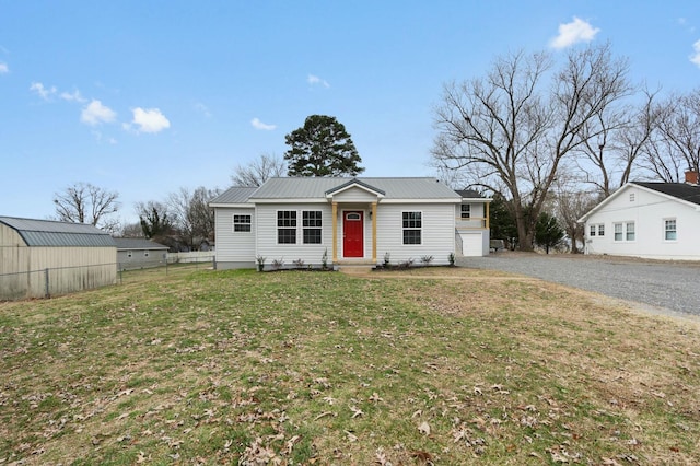 single story home with a garage and a front lawn