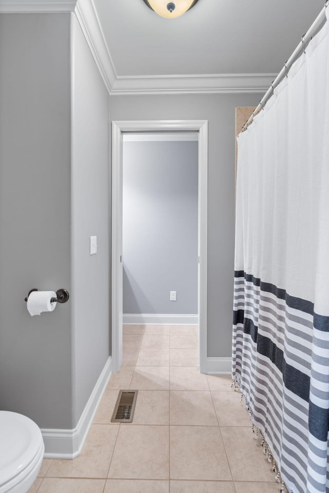 full bathroom featuring crown molding, tile patterned flooring, and visible vents