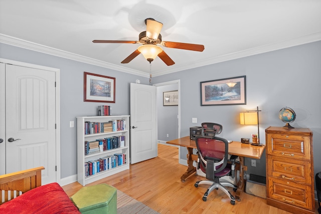 office featuring crown molding, light wood finished floors, and baseboards