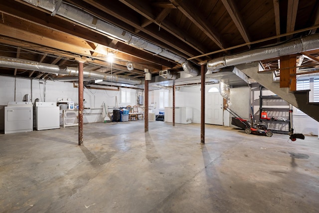 basement with stairs and independent washer and dryer