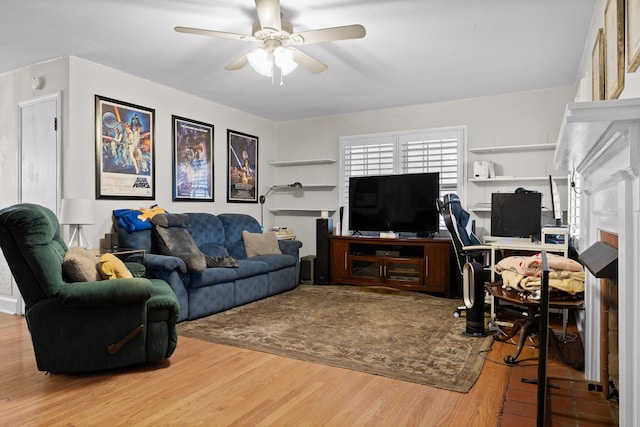 living room with ceiling fan and wood finished floors