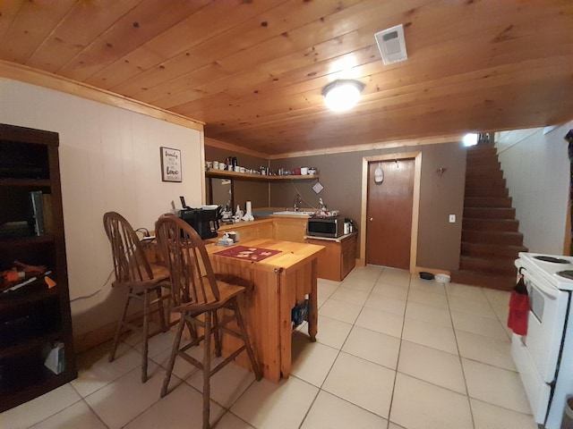 364 Cherokee Trl, Copperhill, TN 37317 - interior space featuring stainless steel microwave, open shelves, electric stove, and wood ceiling