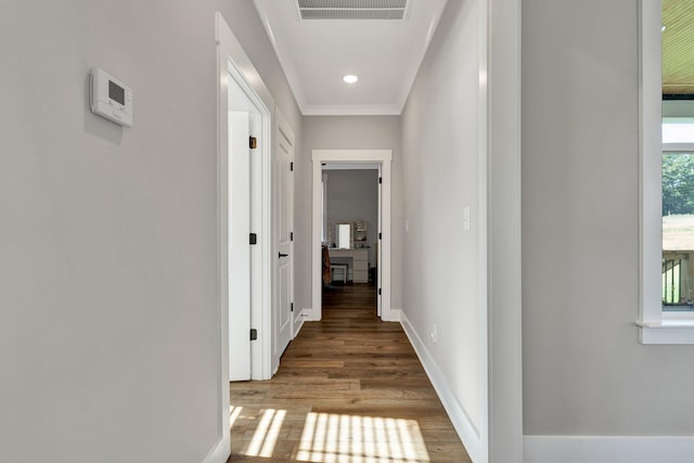 corridor featuring light wood-type flooring and crown molding