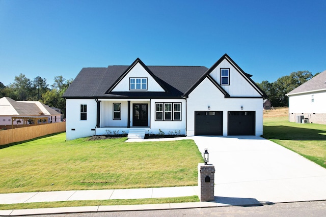 modern inspired farmhouse with a front lawn, a porch, and a garage