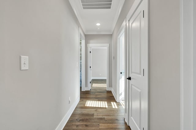 hall featuring dark hardwood / wood-style flooring and ornamental molding