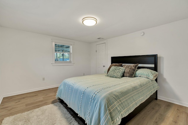 bedroom featuring hardwood / wood-style flooring