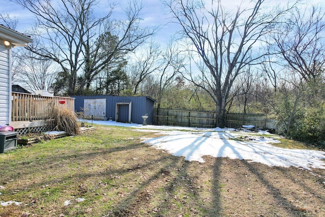 view of yard with an outbuilding and a wooden deck