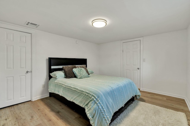 bedroom featuring hardwood / wood-style flooring