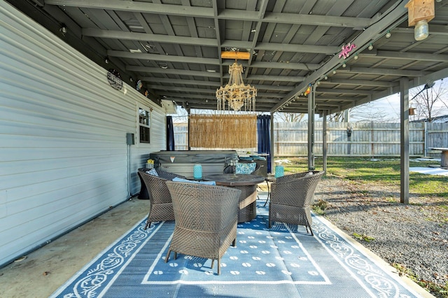 view of patio / terrace with a hot tub