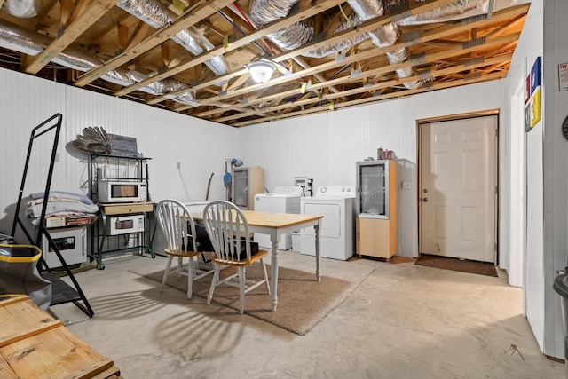 unfinished below grade area with washer and clothes dryer