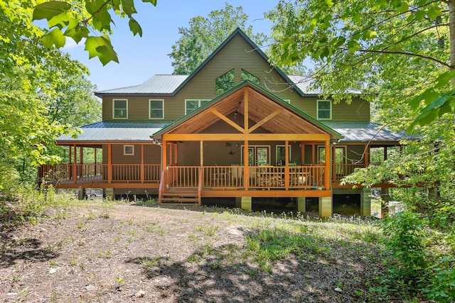rear view of property with metal roof