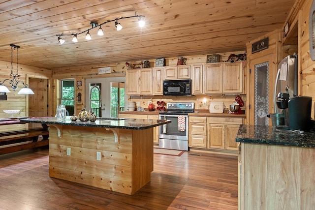 kitchen featuring stainless steel electric range, black microwave, light wood finished floors, light brown cabinets, and a kitchen breakfast bar