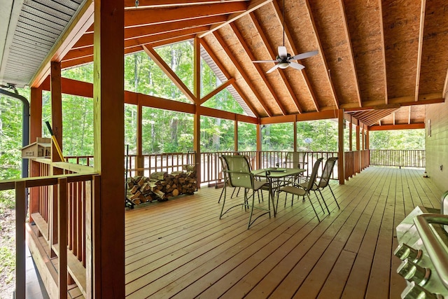 sunroom with a ceiling fan, outdoor dining space, and a wealth of natural light