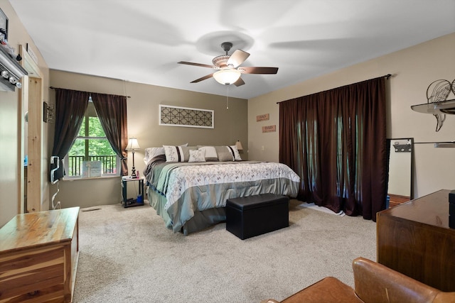carpeted bedroom with a ceiling fan