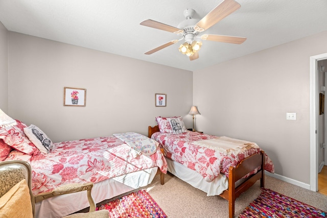 carpeted bedroom featuring ceiling fan