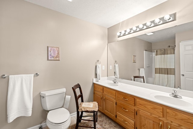 bathroom with a textured ceiling, tile patterned floors, vanity, a shower with curtain, and toilet