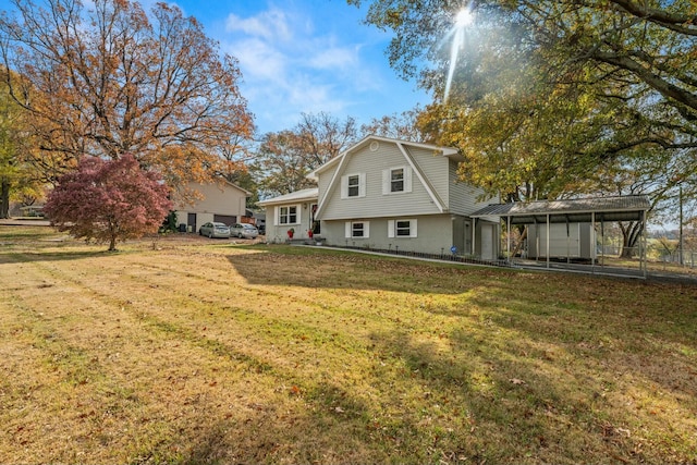 rear view of property featuring a lawn