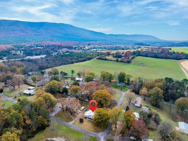 birds eye view of property with a mountain view