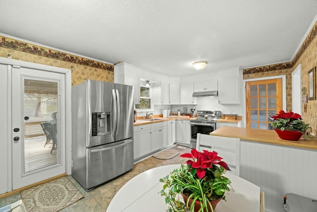 kitchen featuring a textured ceiling, white cabinetry, sink, and appliances with stainless steel finishes