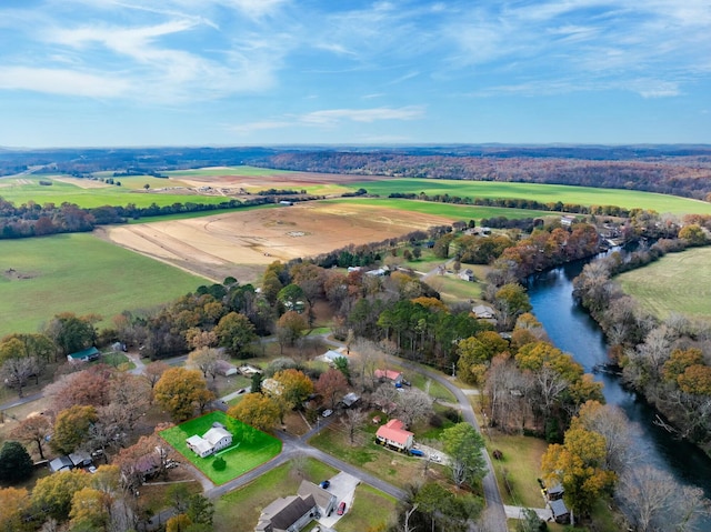 birds eye view of property with a rural view and a water view