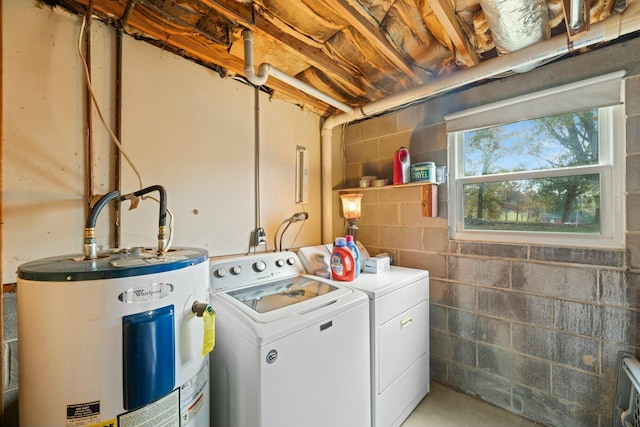 washroom featuring washer and dryer and water heater