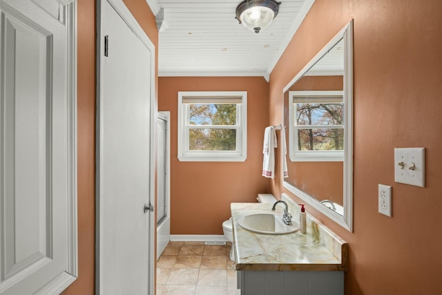 full bathroom featuring combined bath / shower with glass door, vanity, crown molding, tile patterned flooring, and toilet