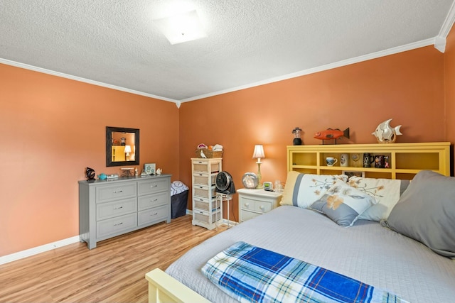 bedroom featuring crown molding, a textured ceiling, and light wood-type flooring