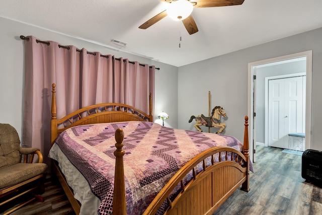 bedroom with ceiling fan and hardwood / wood-style floors