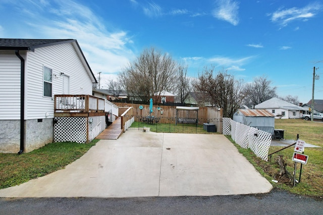 exterior space with a shed and a deck