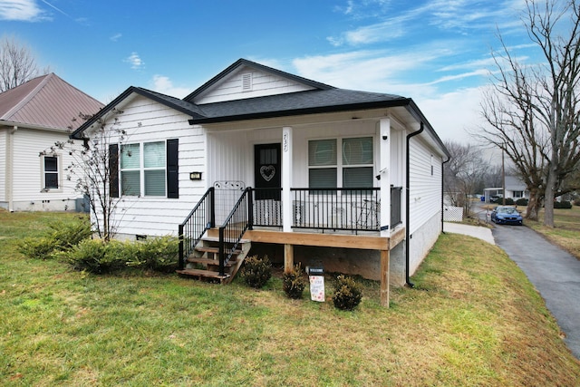 bungalow-style house with a porch and a front yard