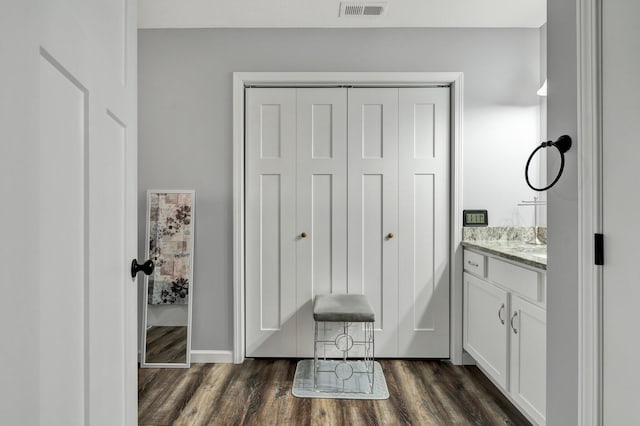 bathroom featuring vanity and hardwood / wood-style floors