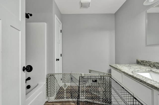 bathroom featuring vanity and tub / shower combination